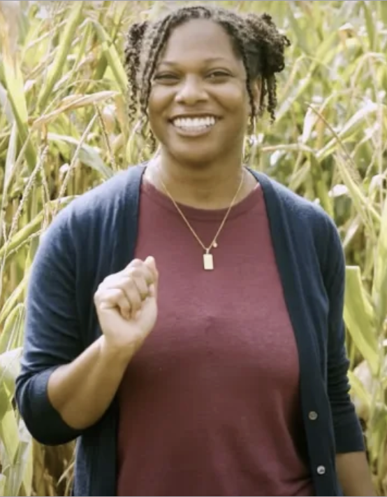 women stands in cornfield