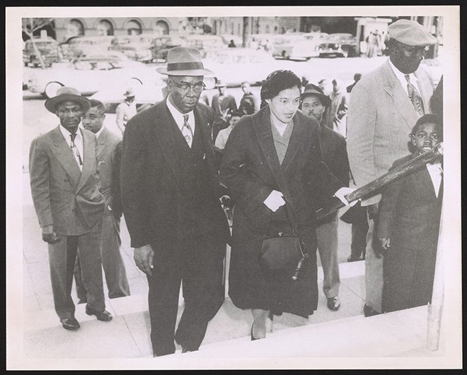E. D. Nixon escorting Rosa Parks to the courthouse in Montgomery, Alabama, to attend the trial of Martin Luther King, Jr., March 1956. Photograph. Visual Materials from the Rosa Parks Papers, Prints and Photographs Division, Library of Congress
