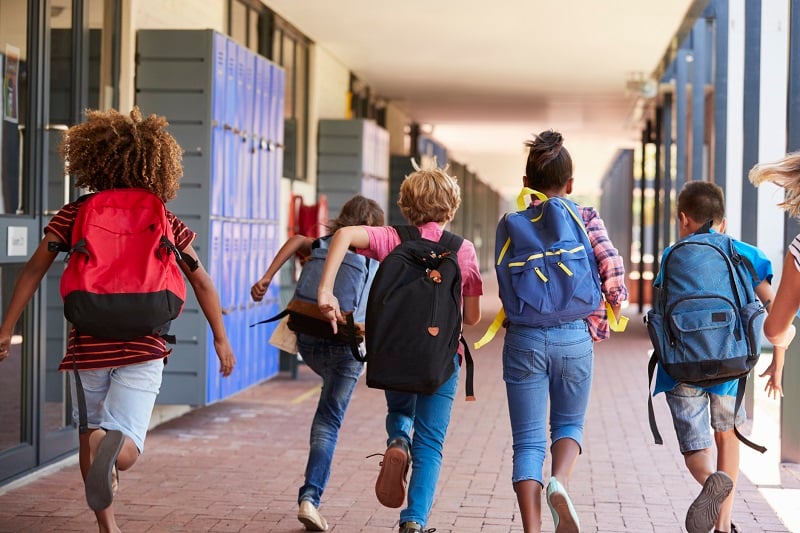 Students running towards summer break